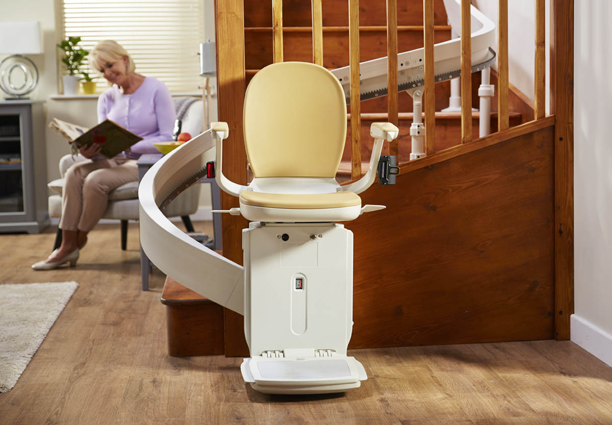 Acorn 180 curved stairlift positioned at the bottom of a staircase